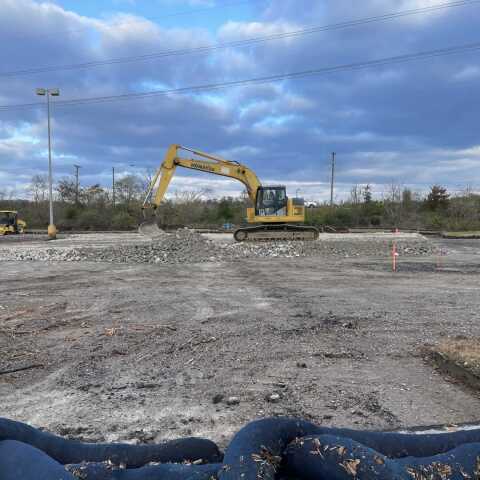 Excavator on rocky construction site