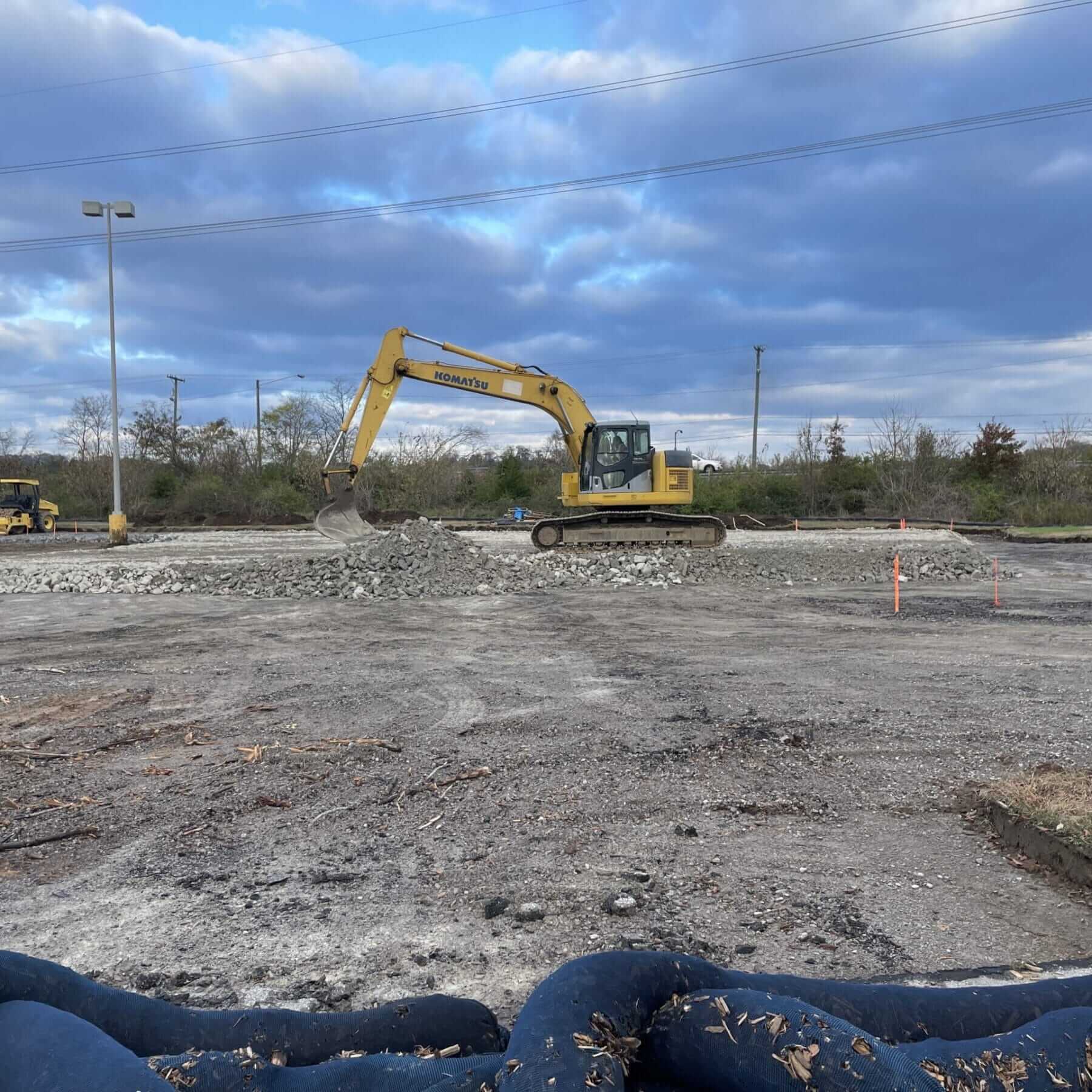 Excavator on rocky construction site