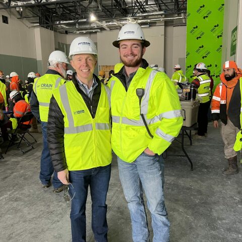 crain construction employees smiling for photo