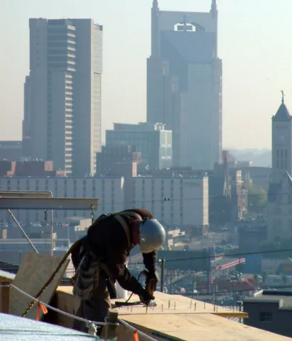 roof nailers working on a commercial roof downtown nashville